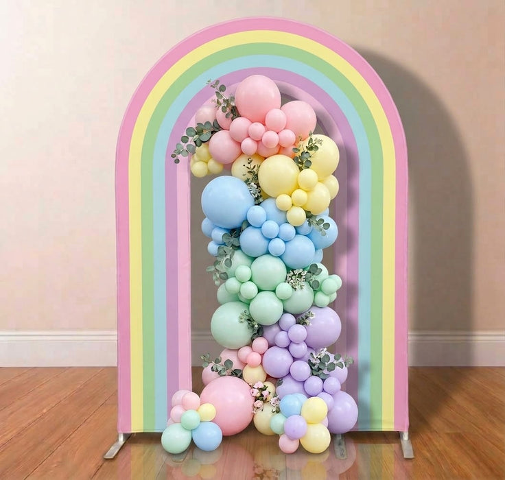 Rainbow arch backdrop decorated with pastel balloon garland